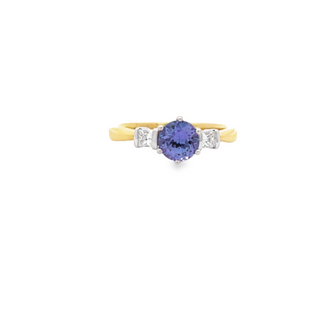 18CT YELLOW AND WHITE GOLD TRILOGY RING CLAW SET AND PART BEZEL SET BRILLIANT CUT TANZANITE AND DIAMOND HAND CRAFTED