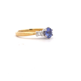 18CT YELLOW AND WHITE GOLD TRILOGY RING CLAW SET AND PART BEZEL SET BRILLIANT CUT TANZANITE AND DIAMOND HAND CRAFTED