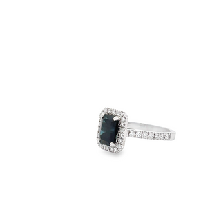 18CT WHITE GOLD CLAW SET HALO DRESS RING EMERALD CUT AUSTRALIAN SAPPHIRE AND BRILLIANT CUT DIAMONDS HAND CRAFTED 