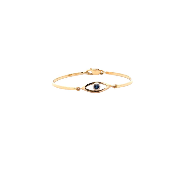 CHILD 18CT YELLOW GOLD BANGLE EYE SHAPE CENTRE BEZEL SET FEATURING NATURAL BRILLIANT CUT BLUE SAPPHIRE HAND CRAFTED BY CRICELLI