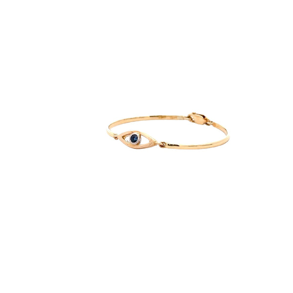 CHILD 18CT YELLOW GOLD BANGLE EYE SHAPE CENTRE BEZEL SET FEATURING NATURAL BRILLIANT CUT BLUE SAPPHIRE HAND CRAFTED BY CRICELLI